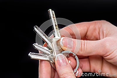 Businesswoman holding keys Stock Photo