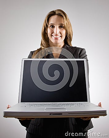 Businesswoman holding laptop Stock Photo