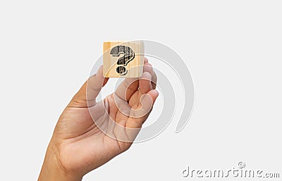 businesswoman holding a question mark on a wood block. concept of Question mark and FAQs, Ask questions online, FAQ concept, what Stock Photo