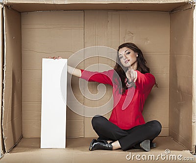 Businesswoman holds a copy space and pointing at you Stock Photo