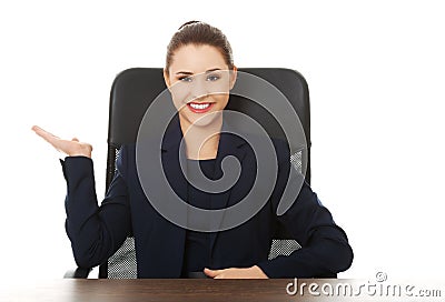 Businesswoman inviting to an office Stock Photo