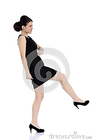 Businesswoman kicking Stock Photo