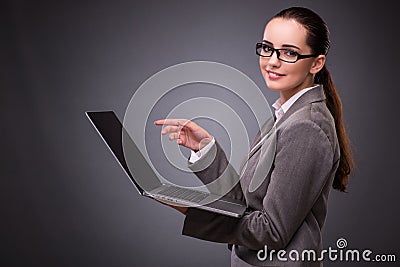 The businesswoman with laptop in business concept Stock Photo