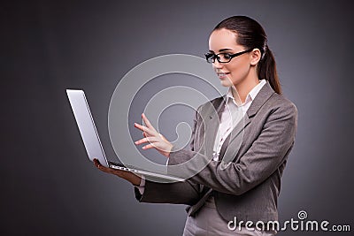 The businesswoman with laptop in business concept Stock Photo