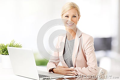 Businesswoman with laptop Stock Photo