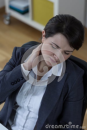 Businesswoman leading a sedentary lifestyle Stock Photo