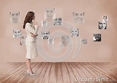 Businesswoman looking at futuristic interface in black and white Stock Photo