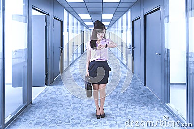 Businesswoman looks hurried in the office corridor Stock Photo