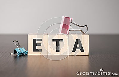 Businesswoman made word eta with wood building blocks Stock Photo