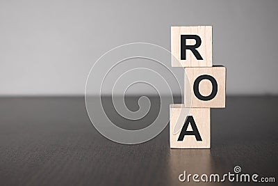 Businesswoman made word roa with wood building blocks Stock Photo