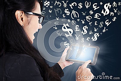 Businesswoman making money online with tablet Stock Photo