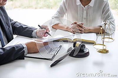 Businesswoman and Male lawyer or judge consult and conference having team meeting with client at law firm in office, Law and Legal Stock Photo