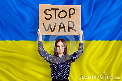 Businesswoman marching european protest crowd against war in Ukraine and Russia invasion carry flags and banners Stock Photo