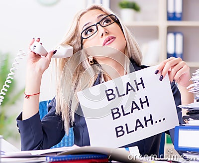 Businesswoman with message in office at desk Stock Photo