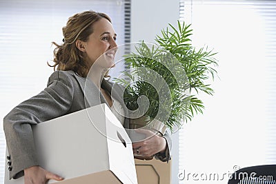 Businesswoman Moves Her Belongings Stock Photo