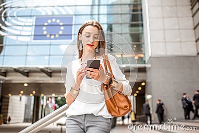 Businesswoman near the parliament building in Brussel Stock Photo