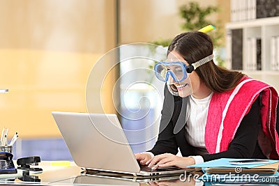 Businesswoman needing vacation booking at job Stock Photo