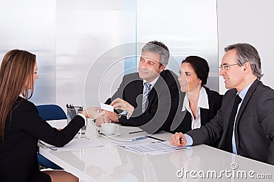 Businesswoman offering business card Stock Photo