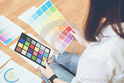 Businesswoman in office in casual shirt. Check document color template for graphic designer. Stock Photo