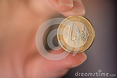 Businesswoman and one euro coin Stock Photo