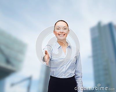 Businesswoman with opened hand ready for handshake Stock Photo
