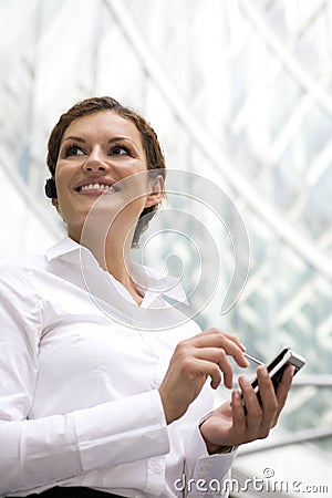 Businesswoman with palmtop Stock Photo