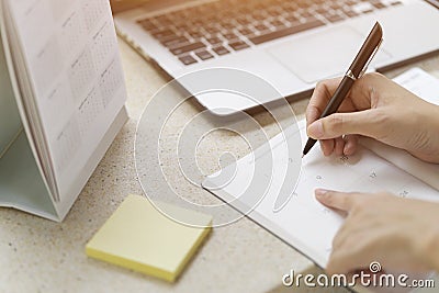 Businesswoman planning agenda and schedule using calendar event Stock Photo