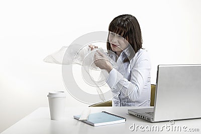 Businesswoman Playing With Plastic Bubble Wrap Stock Photo