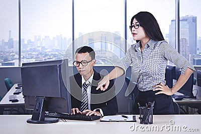 Businesswoman pointing some tasks for her employee Stock Photo