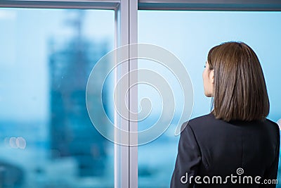 Businesswoman ponder in the office Stock Photo