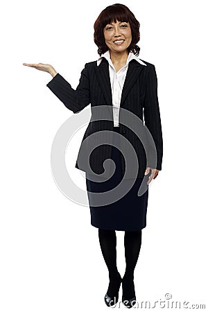 Businesswoman presenting copy space Stock Photo