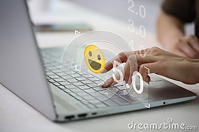 Businesswoman pressing face emoticon on the keyboard laptop .Customer service evaluation concept Stock Photo