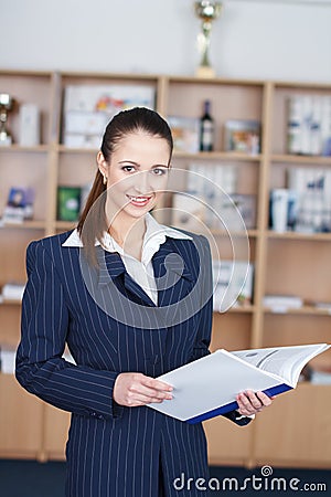 Businesswoman with product catalog Stock Photo