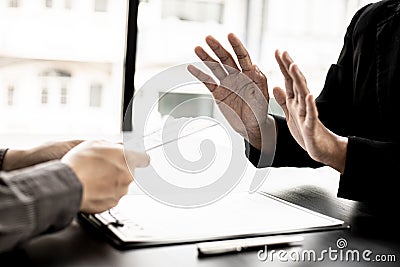 The businesswoman raised her hand to deny this conscience. Stock Photo