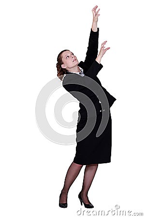 Businesswoman reaching for boxes Stock Photo