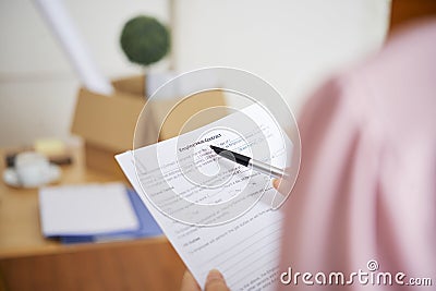 Businesswoman reading employment contract Stock Photo