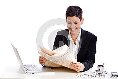 Businesswoman reading newspaper Stock Photo