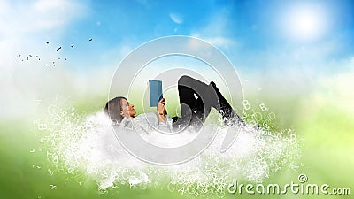 Businesswoman reads a book over a cloud made of letters. Concept of relax and imagination. Stock Photo