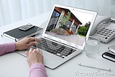 Businesswoman or real estate agent looking through online property portfolio Stock Photo