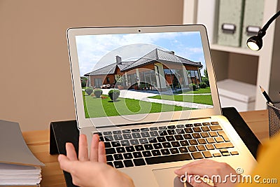 Businesswoman or real estate agent looking through online property portfolio Stock Photo