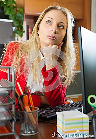 Businesswoman in red having a tedious time Stock Photo