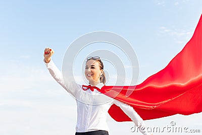 Businesswoman with a red raincoat. Super lady. Super woman Stock Photo