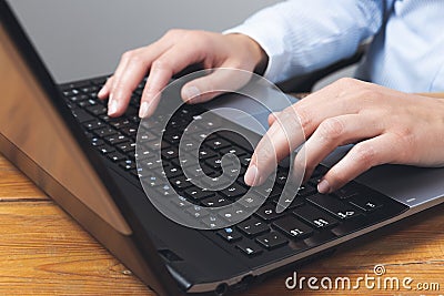 Businesswoman`s hands typing on laptop keybord Stock Photo