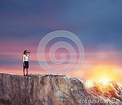 Businesswoman searchs for new horizon, new business opportunities Stock Photo