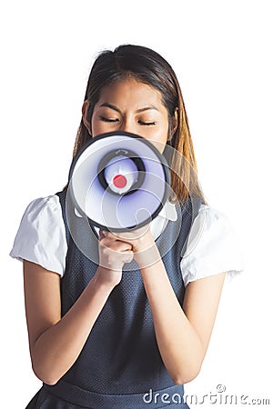 Businesswoman shooting through a megaphone Stock Photo