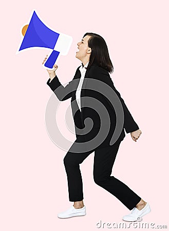 Businesswoman shouting through a megaphone Stock Photo