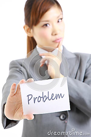 Businesswoman showing a card with word ploblem Stock Photo