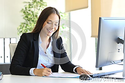 Businesswoman signing a contract Stock Photo