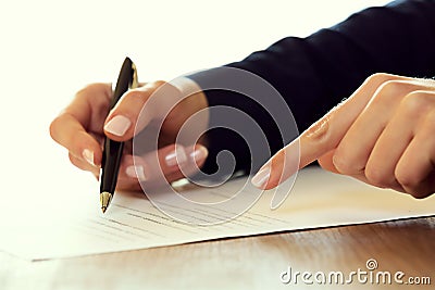 Businesswoman signing a contract Stock Photo