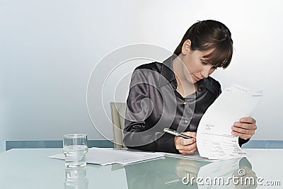 Businesswoman Signing Contract Stock Photo